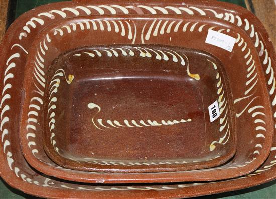 Three 19th century slip-decorated baking dishes